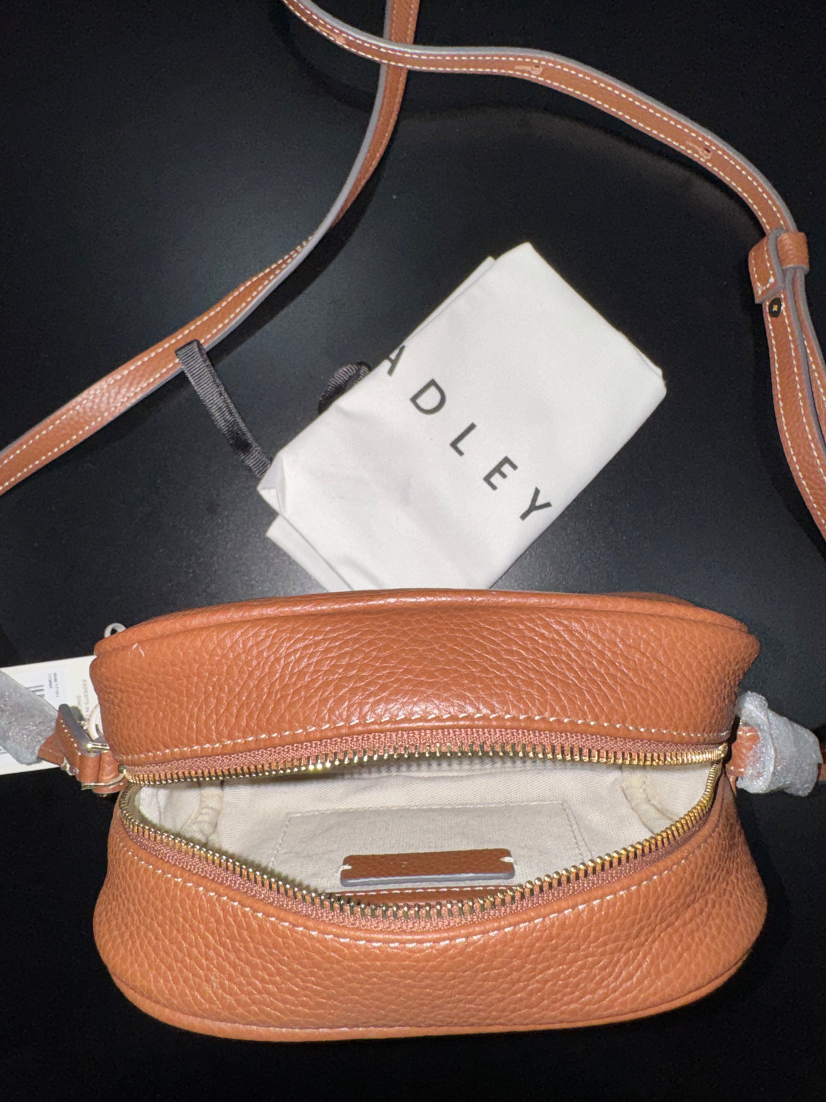 Radley London The Daily
Small Zip Around Cross Body